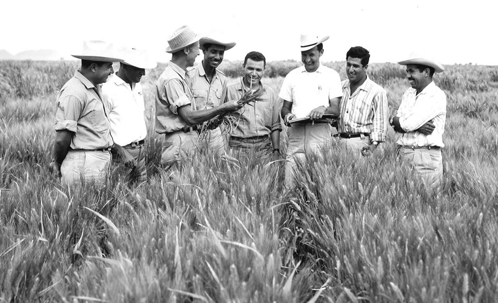 Happy photo of Dr. Norman Borlaug with his friends